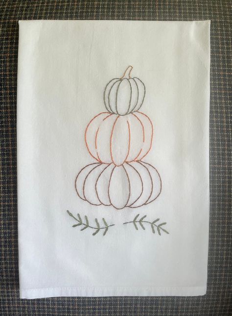 Stack of Pumpkins on flour sack tea towel #farmhousefloursack #fallkitchentowel #farmhousepumpkin Fall Embroidered Tea Towels, Hand Embroidery On Towels, Hand Embroidered Tea Towels Diy, Tea Towel Embroidery Ideas, Hand Embroidery Tea Towels, Hand Towel Embroidery Designs, Embroidered Kitchen Towels Ideas, Hand Embroidered Tea Towels, Embroidered Tea Towels Diy