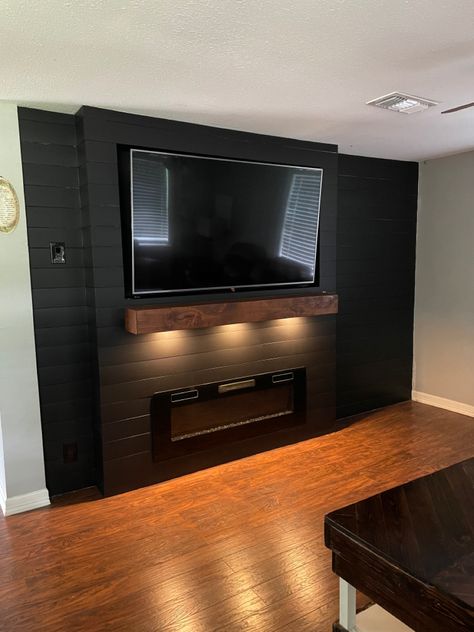 Black Shiplap Wall With Tv, Black Shiplap Living Room Wall, Basement Tv Mount Ideas, Tv Wall Before And After, Black Shiplap Tv Accent Wall, Dark Wall With Tv, Black Shiplap Wall Living Room With Tv, Accent Walls In Living Room With Tv Fire Places, Wood Panel Wall With Tv And Fireplace