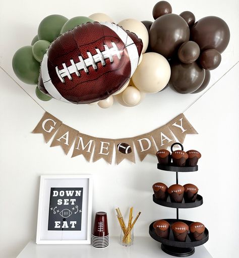 Get your game day celebration ready with our epic party decor!  Complete with sports-themed balloons and a bold 'Game Day' banner, it's the perfect setup to cheer on your favorite team in style.  YOU WILL RECEIVE 1 - Football Balloons, 18 inches An Assortment of Quality Latex Balloons 11 inches and 5 inches 3 ft Balloon Strip Balloon Glue Dots Balloon Garland Instructions Fishing Line One burlap football flags with the words Game Day in white letters. Strings & A Needle for banner assembly Add m First Down Party Decor, Football Tent Decorations, Football 5th Birthday Party, Tailgate Theme Party Decorations, 1 Year Down Football Birthday, 1st Birthday Football Theme Food, Game Day Party Decorations, First Down Party, Sport Birthday Party Ideas