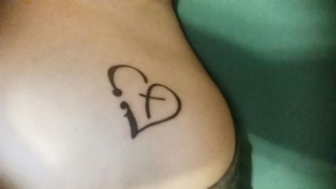 I'm in love with this semicolon, heart, cross Christian tattoo. What a beautiful, meaningful way to honor our God. Such unique and meaningful tattoo design ideas for women including small cross, verses, symbols on foot, wrist, forearm and more. #wristtattoos #cutetattoos #tattoosforwomen #smalltattoos #tattooideas #minimalisttattoo #christiantattoo #christiantattoosforwomen Cross Heart Tattoos, Cross Tattoo On Wrist, Grace Tattoos, Jagua Henna, Christian Tattoo, Verse Tattoos, Cursive Tattoos, Cross Tattoos For Women, Tattoo Heart