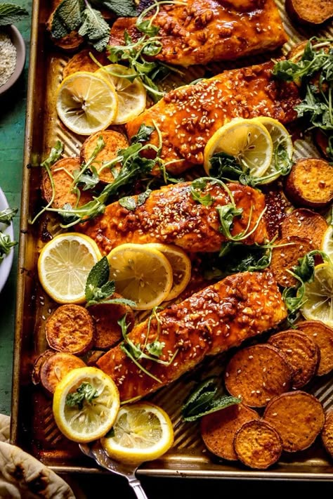 A fun take on a Middle Eastern street food favorite with spiced, lemony baked salmon alongside sweet potatoes. Serve it with naan and sesame arugula for a healthy meal in under an hour. Salmon Stuffed Sweet Potato, Salmon Recipes With Sweet Potatoes, Sweet Potato Salmon Recipes, Baked Salmon With Potatoes, Middle Eastern Salmon Recipes, Middle Eastern Seafood Recipes, Middle Eastern Salmon, Middle Eastern Fish Recipes, Salmon And Sweet Potatoes Recipes