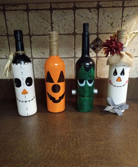 Seasonal Wine Bottle Decor, Great center pieces, for every holiday table or mantel. Made to order Frankenstein Wine Bottle, Fall Wine Bottles Diy, Christmas Crafts With Wine Bottles, Things To Do With Wine Bottles, Wine Bottles Crafts, Halloween Wine Bottles Diy, Liquor Bottle Decor, Recycled Wine Bottle Art, Holiday Wine Bottle Crafts