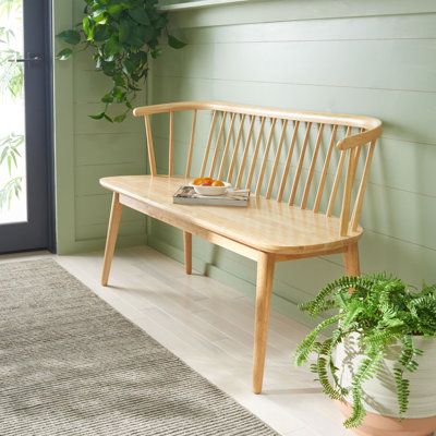 Bring timeless elegance to any corner with our Ayaah spindle bench. Deeply inspired by the sturdy and airy Windsor-style furniture, our bench features a subtly curved spindle back. A sculpted seat and tapered legs add a sleek modern touch to the bench. Crafted in solid wood, it showcases the natural textures to attain a chic and inviting. The bench can easily be styled in entryways, hallways, and dining rooms to offer a comfy seat and a dose of elegance. Color/Pattern: Natural | Wade Logan® Ayaa Hallway Bench Ideas Entryway, Foyer Seating, Wooden Bench Indoor, Spindle Bench, Small Entryway Bench, Custom Bench, Hallway Bench, Entry Ideas, Solid Wood Benches