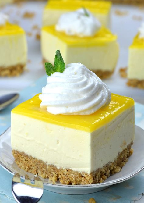 Piece of No Bake Lemon Cheesecake Bar on a white plate with cool whip topping in front of couple of pieces. Microwave Cheesecake, Lemon Keto, Cheesecake Lemon, Cheesecake Bars Easy, Cheesecake Bar, No Bake Lemon, Recipe Cheesecake, Desserts Summer, No Bake Lemon Cheesecake