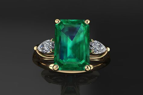 Actress Michelle Yeoh's emerald ring, set in yellow gold, with two pear-shaped accent diamonds Crazy Rich Asians Ring, Square Diamond Rings, Smaragd Ring, Crazy Rich Asians, Crazy Rich, Natural Emerald Rings, Green Emerald Ring, Gold Rings Jewelry, Emerald Engagement