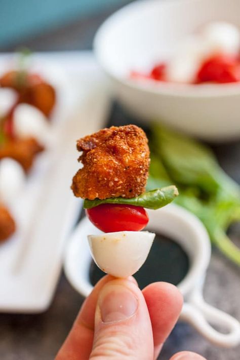 These crispy chicken bites are lightly fired and skewered with mini mozzarella balls, fresh tomato, and basil! The perfect appetizer that combines fresh flavors and crispy fried chicken nuggets! macheesmo.com #friedchicken #caprese #balsamic #appetizers Mozzarella Ball Appetizers, Caprese Bites Appetizers, Crispy Chicken Bites, Mini Mozzarella Balls, Caprese Bites, Fried Chicken Nuggets, Basil Bread, Mozzarella Balls, Chicken Minis