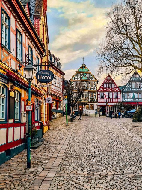 Cobbled streets with many ornately coloured buildings in Germany German Village, Cities In Germany, Visit Germany, Hamburg Germany, Medieval Town, Beautiful Villages, Wine Region, Filming Locations, Germany Travel