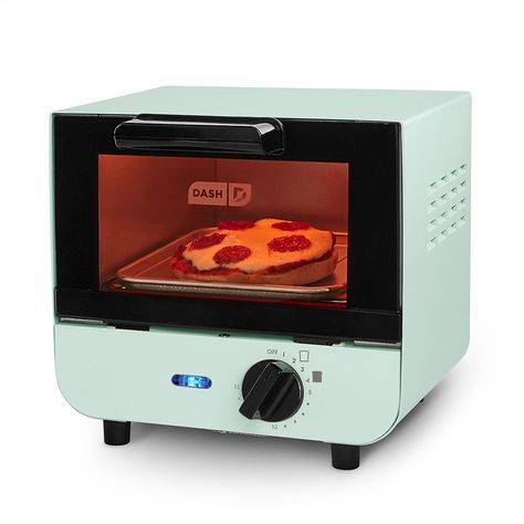 "The Dash Mini Toaster Oven is perfect for cooking with limited counter space. Make single slices of toast, bagels, mini-pizzas and even cookies!  Cute and compact size is easy to store or fit on a countertop. 1-slice capacity, great for a quick quick single slice of toast, bagel or mini-pizza. Temperature Dial for precise control over cooking. Auto shut-off feature prevents overcooking. Easy-to-clean removable baking tray, oven rack and crumb tray. Auto shut-off feature prevents overcooking.WHA Mini Toaster Oven, Mini Toaster, Mini Appliances, Cookies Cute, Make Garlic Bread, Easy Bake Oven, Bagel Bites, Oven Rack, Best Oven