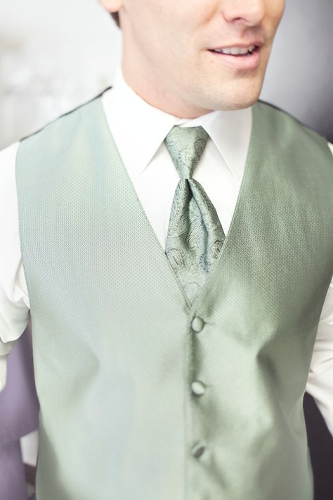 Sage green tux vest with paisley tie (possible for Robin with maybe the tux in a dark grey or sterling silver) Sage Vest Men, Tuxedo With Sage Green Tie, Sage Green Vest Groom, Sage Green Waistcoat, Black Tux With Sage Green, Sage Green Chambelanes, Black Suit With Sage Green Tie, Sage Groomsmen Attire, Coquette Quince