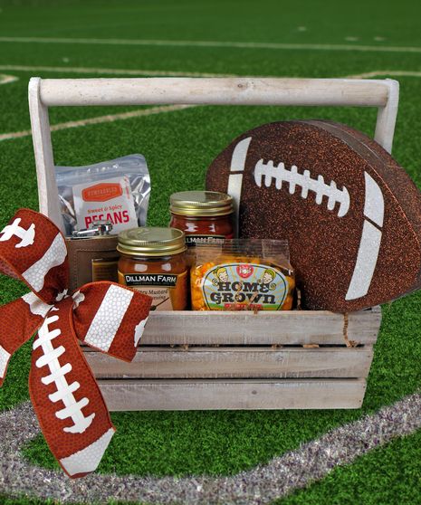 GIFT BASKET, FOOTBALL, SUPER BOWL, GIFTS This football crate is overflowing with local goodies meant for the big game! Enjoy "Indy Style" popcorn from Just Pop In, Salsa and Honey Mustard Dipping Sauce from Dillman Farm, Sweet & Spicy Pecans from Newfangled confections, and a flask (where you can enjoy whatever you would like!)  Decorated with a giant foam football and football ribbon, ready to rumble! Football Bouquet Gift Ideas, Football Raffle Basket Ideas, Tailgate Basket Ideas, Senior Night Baskets Football, Fall Raffle Basket Ideas, Football Gift Baskets, Super Bowl Gifts, Quarter Auction, Spicy Pecans