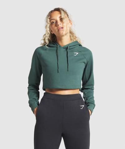 IN YOUR LOCKER  - Cropped length - Drawcord hood - Cuffed wrists - Shaped hem - Logo to chest - Main: 69% Cotton, 31% Polyester. Rib: 96% Cotton 4% Elastane - Model is 5’7" and wears size S - Label Colour: Obsidian Green  You’ll want to keep this little treasure under lock and key. The shaped hem on this loose-fitting cropped hoodie gives it a distinct shape, and with our logo front and centre, it’ll give you the Gymshark edge. Gym Hoodies, Fran Fine, Gym Jacket, Gym Shark, Gym Hoodie, Hoodie Green, Good Attitude, Seamless Leggings, Hoodie Top