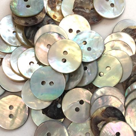 20mm cream AB shell buttons which are finished on one side and unfinished on the other. These buttons are approximately 1mm thick and have two holes These buttons are made from a natural product and hence there may be some variations in colour. Number in pack - 10 buttons Colour - Cream/natural Width - 20mm Material - shell SKU - BUT950 Natural Buttons, Silver Keychain, Sewing Buttons, Button Art, Shell Buttons, Button Crafts, Sewing A Button, Mother Of Pearl Buttons, Pearl Buttons