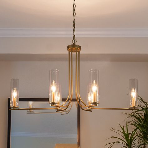 A classic fixture for your modern decor, this 6-light gold chandelier elegantly illuminates your living room, dining room, and bedroom. Modern Gold Chandelier, Dinning Room Lighting, Modern Dining Room Lighting, Gold Light Fixture, Chandelier For Dining Room, Dining Chandelier, Unique Chandeliers, Dining Room Light Fixtures, Candle Chandelier