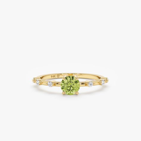 Belinda Celebrate the vibrancy of August with the Round Peridot Diamond Station Ring. This 18k solid gold ring features a luminous peridot gemstone, the birthstone for August, elegantly surrounded by sparkling white diamond accents. The ring's dainty design and vibrant colors make it a timeless piece for everyday wear or special occasions. - Handmade- Solid Gold- Natural Diamonds and Peridot - G Color, SI Quality Diamonds- Total Peridot Carat Weight: 0.47 ctw- Total Diamond Carat Weight: 0.08 ctw- Height of the Setting: 4.5 mm- Dimensions of the Setting: 5 mm x 5 mm - Band Thickness: 1.2 mm All pieces come beautifully boxed in suede pouches you can always use when traveling! Peridot Birthstone, Solid Gold Bracelet, Solid Gold Ring, Peridot Ring, Peridot Gemstone, Solid Gold Rings, Eternity Ring Diamond, Diamond Carat, Gold Wedding Rings