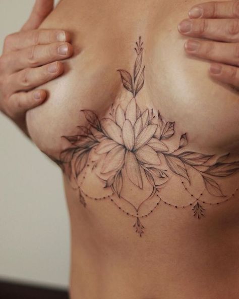 Breast tattoos are a beautiful way to express yourself and your individuality. These 40+ designs are sure to steal your heart in 2023. Looking for your next tattoo design? Check out our extensive collection of tattoo sketches and find your perfect match!#tattoo #tats #tattoo_desing#female_chest_tattoos #chest_tattoos #chest_floral_tattoo Chest Tattoo Female Underboob, Breast Lift Scar Tattoo, Lotus Sternum Tattoo Women, Breast Lift Tattoo Cover Up, Mid Chest Tattoo Female, Shoulder Tattoos For Women Unique, Women Sternum Tattoo, Mandala Sternum Tattoo, Brust Tattoo Frau