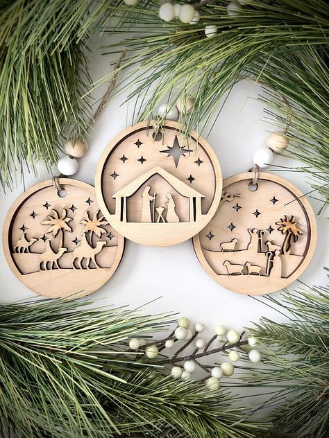 Beautiful layered wooden nativity Christmas ornament 3-piece set. Each ornament is laser engraved and hand finished. Product Details: Approx. 3.5" wide, 3.5" high, 0.25" deep Stacked, 3-layered design Each ornament will come strung with twine and two wooden beads. Wooden Nativity Ornaments, Wood Laser Ornaments, Christmas Ornament Laser Cut, Christmas Ornaments Laser Cut, Laser Engraved Ornaments, Laser Engraving Ideas Projects, Laser Cut Christmas Decorations, Laser Ornaments, Laser Cut Wood Ornaments