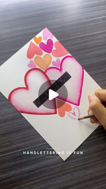 Tanisha | lettering | calligraphy on Instagram: "all the hearts today🫶🏼✨  I hadn’t planned on creating something for tomorrow but had this idea in mind went ahead and did it! Hope you enjoy watching this video❤️  .  I’m using: @karinmarkers brushmarker pro @brustro_official fude hard-tip brush pen  @kokuyo.camlin transparent photo colours  @cansonpaper montval watercolour paper   .  .  .  .  .  .  .  .  #Handletteringisfun #Handlettering #calligraphy #lettering  #moderncalligraphy #brushlettering  #calligraphyart  #letteringartist #LetteringIndia  #art" How To Use Brush Pens, Brush Pen Ideas, Pen Ideas, Transparent Art, Handlettering Calligraphy, Brush Pen Art, Love Birthday Cards, Watercolor Brush Pen, Lettering Calligraphy