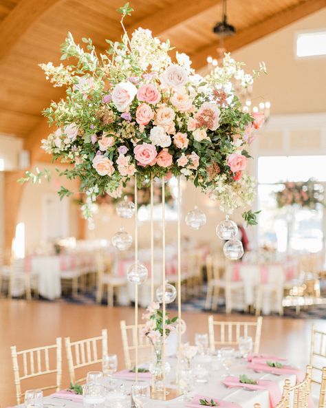 30 Rose Centerpieces That Will Upgrade Your Reception Tables #WeddingCenterpieces #RoseCenterpieces #WeddingFlowers #WeddingInspiration | Martha Stewart Weddings Rose Centerpieces Wedding, Wedding Table Pink, Pink Wedding Receptions, Lantern Centerpiece Wedding, Seaside Garden, Tall Wedding Centerpieces, Simple Wedding Centerpieces, Rose Centerpieces, Centerpieces Wedding