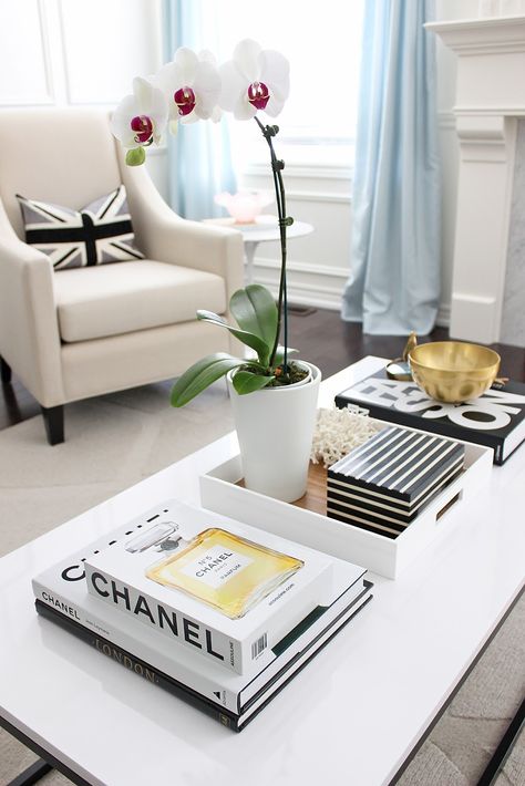 Coffee Table Makeover, box frame coffee table, white lacquered coffee table, orchid, chanel coffee table book, black white living room styling Chanel Coffee Table Book, Fashion Coffee Table Books, Coffee Table Books Decor, Coffee Table Inspiration, Coffee Table Makeover, White Coffee Table, Black And White Living Room, Books Decor, Table Decor Living Room