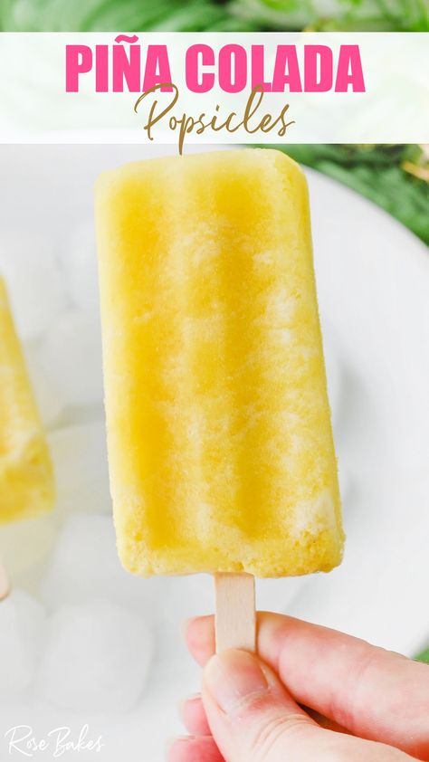 A hand holding the stick of a yellow popsicle that is pina colada flavored. Dole Whip Popsicles, Pina Colada Popsicles, Pineapple Popsicles, Tropical Desserts, Homemade Popsicles, Dole Whip, Ice Cream Treats, Popsicle Recipes, Summer Snacks