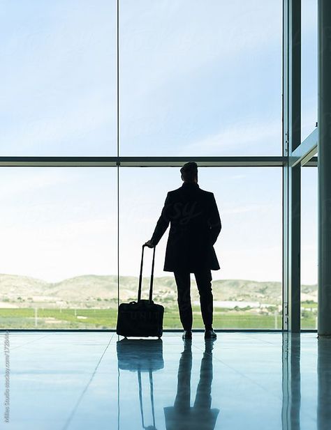 Anonymous businessman in airport by Milles Studio for Stocksy United Back view of elegant man in coat standing with suitcase against window with picturesque landscape. Airport Photos For Men, Airport Photography Men, Man Back View Photography, Airport Poses For Men, Airport Look Men, Man With Suitcase, Airport Photoshoot, Airport Photography, Man Travel