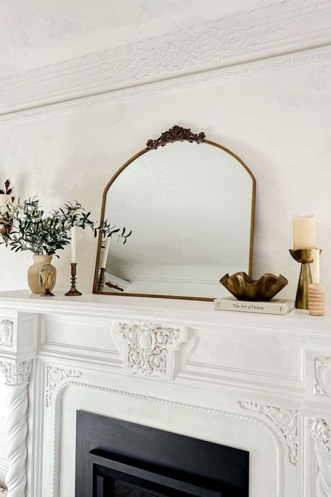 Want to change up your home décor for the spring? Honest Darling is sharing how she decorated her fireplace mantle for Spring. This mantle décor is chic and cozy perfect for any living room space. Follow for more home décor ideas, decorating shopping guides, and style tips. (I make commissions for purchases made through the link in this pin) Mirrors On Mantle, Mirror Mantle Decor, Above Fireplace Decor, Decorate Your Fireplace, Spring Mantle, Mantel Mirrors, Fireplace Mantel Decor, Home Decor Idea, Spanish Style Home