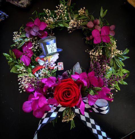 💙How adorable are these Alice in Wonderland themed wreaths!?!🤍🤍🤍 I'll have a few of these available for my newest update, Friday May 3rd at 6pm. Alice In Wonderland Wreath, Themed Wreaths, Wonderland Decorations, Alice In Wonderland Decorations, Mad Hatter Tea, Mad Hatter Tea Party, Mad Hatter, High Tea, Door Wreaths