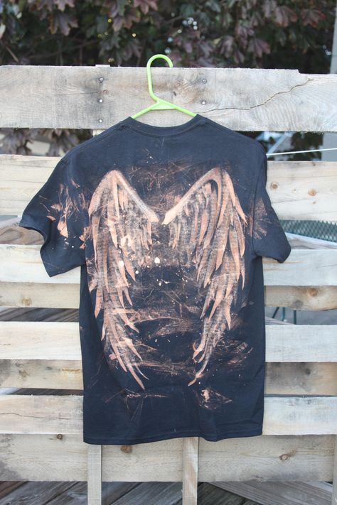 Y2K inspired bleach-dyed t-shirt Bleached Diy Shirts, Bleach Sweatshirt Ideas, Custom Bleached Jeans, Dyed Jeans Diy, Bleach Printed Shirts, Bleach Shirt Drawing, Black Shirt Bleach Designs, Y2k Bleached Shirt, Bleach Diy Clothes