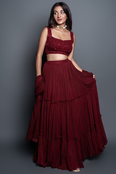 Featuring a maroon tiered pleated lehenga in georgette base with sequins embroidery. It is paired with a matching chikankari blouse and a dupatta.   FIT: Fitted at bust and waist. COMPOSITION: Georgette, Chikankari. CARE: Dry clean only. Lehenga Simple, Pleated Lehenga, Strappy Blouse, Maroon Lehenga, Simple Lehenga, Lehenga Designs Simple, Gaun Fashion, Choli Designs, Red Lehenga