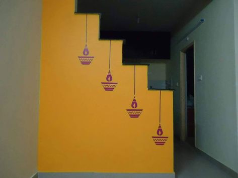 Diya stencil for interior design ideas and colour temple Balcony Wall Painting Ideas, Wall Painting Ideas Indian, Indian Wall Painting, Brahmi Script, Asian Paint Design, Pooja Backdrop, Simple Wall Paintings, Wall Colours, Stencil Wall Art