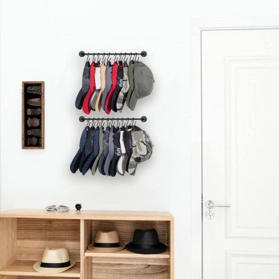 This hat organizer for wall comes with 20 rust-resistant "S" hooks, which can hold 20 caps. Best for snapback caps, visors or hats with straps. Addictional provide 10 "A" clips to meet all types of hats storage needs. This hat organizer for wall will not only storage all your baseball caps, hats, visors, snapback caps, make hats organized and easy access. You can also use it as scarfs, coats, belts, purse hooks rack in your room, but also a bathroom organizer to hang your towels, or in your entryway for bags and keys Latitude Run® | Latitude Run® Hat Rack For Wall Baseball Cap Organizer Hanger w/ 20 Hooks, Set Of 2, Black, Metal | C112101741 | Wayfair Canada Ball Cap Storage, Cap Wall, Cap Rack, Scarf Storage, Cap Organizer, Wall Hats, Hanging Hats, Hat Organization, Hat Holder