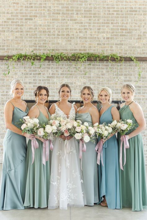 Bride with bridesmaids in multicolor bridesmaids dresses in blue and green colors Bridesmaid Dresses Blue And Green, Blue And Green Bridesmaid Dresses, Multicolor Bridesmaid Dresses, Green Bridesmaid Dresses Mismatched, Aqua Blue Bridesmaid Dresses, Brides Maid Dresses Blue, Mismatched Green Bridesmaid Dresses, Color Bridesmaid Dresses, Aqua Bridesmaid Dresses