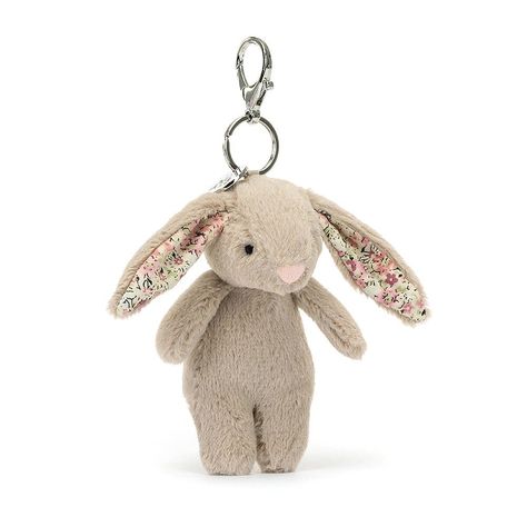 Put a hop in your step wherever you go with the Blossom Beige Bunny Bag Charm! This bouncing charm is beautifully soft, with praline fur, a fluffy cream bobtail and ditsy-print ears in blush, white and moss. With a silver chain, claw clip and Jellycat tag, this bunny makes any bag bonny. Recommended Age: Recommended for 3 years + due to small parts. Care Instructions: Hand wash only; do not tumble dry, dry clean or iron. Not recommended to clean in a washing machine. Dimensions: H17 X W4 CM Cher Matching Things, Personalised Jumpers, Pretty Products, Summer Wishlist, 2024 Wishlist, Bunny Bags, Personalized Bunny, Ditsy Print, Beige Bag