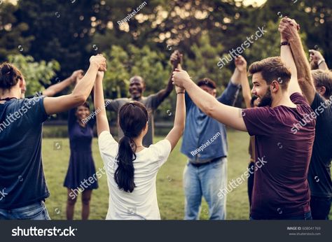 Group of people holding hand together in the park Outdoor Corporate Event, Outdoor Team Building Games, Corporate Event Activities, Team Building Challenges, Team Bonding Activities, Hand Together, Teamwork Activities, Corporate Team Building Activities, People Holding Hands