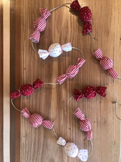 A sweet addition to your holiday decor! This garland consists of wrapped 'candies' in red and white fabrics- both striped and polka dotted. Use to decorate your mantle, Christmas tree, and more! Size- individual 'candies' are about 4 inches long.  *6 foot garland consists of 10 candies  *9 foot garland consists of 16 candies -Each garland is hand crafted with love; meaning that each one is completely unique and may vary slightly. Candy Garland, Love Meaning, Mantle Christmas, Fabric Christmas Decorations, Christmas Craft Fair, Homemade Christmas Decorations, Cottage Christmas, Christmas Tree Garland, Holiday Garlands