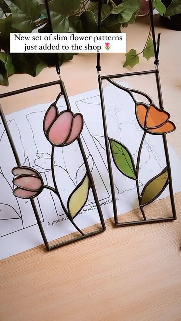 Wild Soul Stained Glass Patterns on Instagram: "Happy Thursday lovelies! Hope your all having a fabulous week 🙌🏼 I’ve just added a new pattern set to the shop which I just finished today….a set of 3 slimline flower panels each flower in a different whimsical design! 🌷 . These were so fun to make and I love the thought of them all hanging up in a window together when I get round to finding them a home! 💜 . . ." Stained Glass Patterns Flowers, Stained Glass Flowers Patterns, Stained Glass Spring, Flower Stained Glass, Stained Glass Flower, Diy Staining, Glass Suncatchers, Stained Glass Pattern, Stained Glass Ornaments