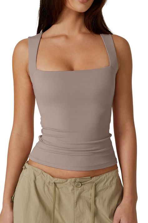 PRICES MAY VARY. Exceptionally Soft and Stretchy Fabric: Offer yourself the luxury of supreme comfort with our QINSEN sleeveless square-neck top. Crafted from a high-quality blend that's both delicately soft and impressively stretchy, this top promises a snug fit that gracefully accommodates your movements throughout the day. Elegantly Minimalist Design: Embracing a minimalist and body-positive design philosophy, our elegantly form-fitting top highlights your natural silhouette with its sleek pr Double Layer Tank Top, White Suspenders, Layered Tank Top, Korean Casual, Layering Tanks, American Women, Womens Vest, Square Neck, Summer Collection