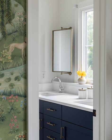 Unique spaces in a renovation are a favorite to design! The homeowner moved in with the bathroom nearly complete, just needed finishing touches and a way to address the vanity mirrors, as there is a window in the middle of the double sink vanity! We added a #brass #swivelmirror mounted on either side of the window, above each sink. Fun and unexpected! Photography: @j.astr #windowabovesink #windowabovethesink #windowoverthesink #bathroomwindow #vanitywindow #bathroomdesign #bathroomrenovat... Bathroom Sink With Window, Bathroom Window Above Sink, Bathroom Vanity By Window, Bathroom Mirror In Front Of Window, Vanity With Window Above, Vanity With Window, Vanity Mirror Over Window, Window Vanity Bathroom, Mirror On Window Bathroom