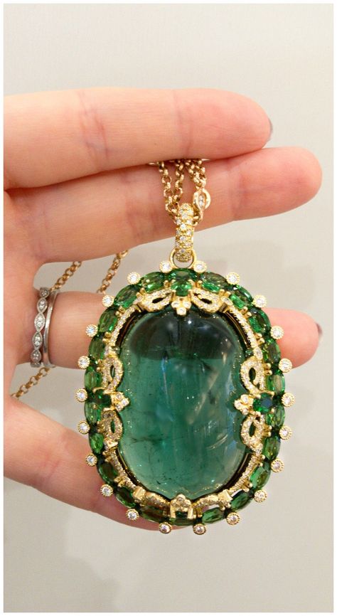 An incredible tourmaline cabochon pendant necklace by Erica Courtney. Sparkly Jewelry, Fancy Necklace, Bollywood Jewelry, Diamond Jewelry Designs, Cabochon Pendant, Art Deco Jewelry, Stone Jewelry, Tiara, Amazing Jewelry