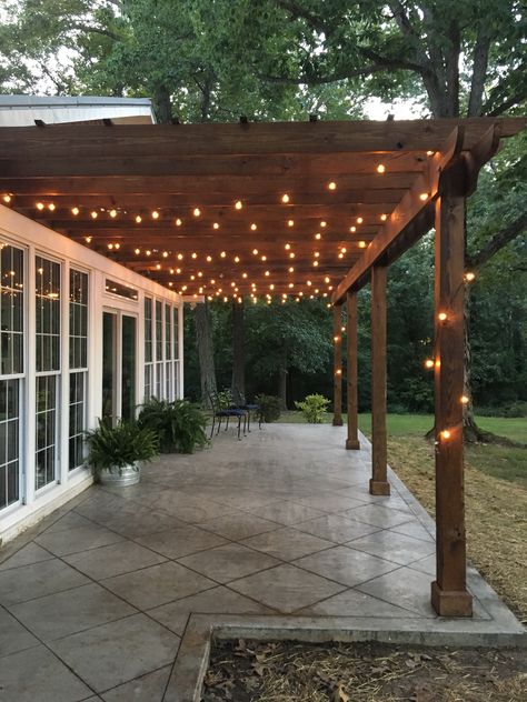 Back Porch With Lights, Concrete And Wood Patio Ideas, Small Deck String Lights, String Lights Rectangle Patio, Western Back Porch Ideas, Pergola Lights Ideas, Lights On Pergola Outdoor, Pergola String Lights, Table On Porch