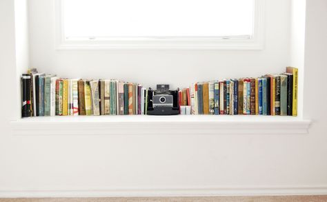 Idea for our old Polaroid camera and books. @jonathan budisantoso Windowsill Ideas, Baby Shelves, Window Sill Decor, Brighter Bedroom, Window Ledge, White Books, Book Display, Shelf Styling, Home N Decor