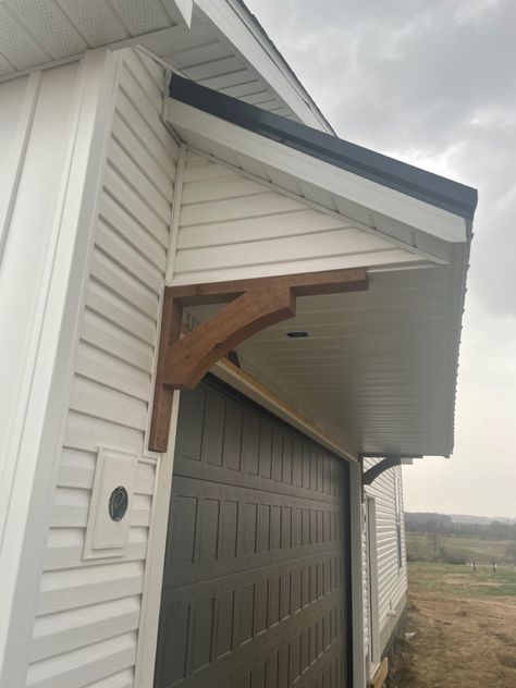 Cedar Corbels Exterior, Garage Eyebrow, Pergola Over Garage Door, Corbels Exterior, Faux Wood Garage Door, Wood Garage, Garage Roof, Wooden Corbels, Wood Garage Doors