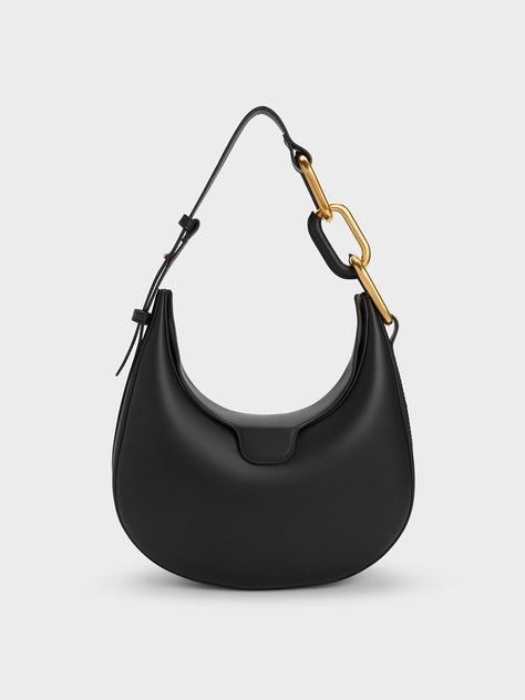 An elevated essential through and through, the Kora moon bag is a stylish accessory that you will definitely want to use on repeat. In classic black for maximum style mileage, this bag also features an edgy two-toned chunky chain accent for a touch of edgy cool. Thanks to the relaxed half-moon shape, this bag opens up into a surprisingly spacious interior with enough room to hold all your everyday must-haves and then some. Charles And Keith Bags, Chill Girl, Winter Handbags, Moon Bag, Coastal Granddaughter, Stylish Purse, Girly Accessories, Fancy Bags, Kitten Heel Pumps