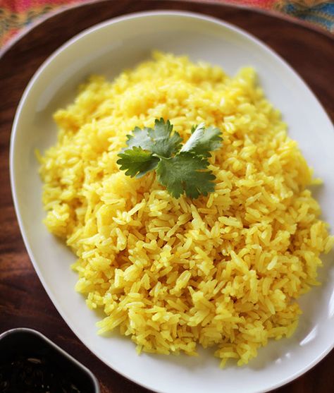 Pilau Base Rice! 3 tbsp vegetable oil, 4 cloves, 3 cardamom pods, 2cm cinnamon stick, 1tsp cumin, 1tsp turmeric powder, 1-2 tbsp salt, 6 shallots sliced, ½ c cashews (optional), ½ c white raisins (optional), 1.5c rinsed basmati rice, 3c boiling water; 1. Heat oil & add spices, shallots, cashews, raisins, mix & simmer until fragrant; add rinsed rice & mix until well coated.  2. Add boiling water, mix.  3. Cover, and put on low heat for 12-15 minutes! Java Rice Recipe, Java Rice, Yellow Rice Recipes, Easy Filipino Recipes, Panlasang Pinoy, Pinoy Recipes, Steamed White Rice, Turmeric Recipes, Yellow Rice