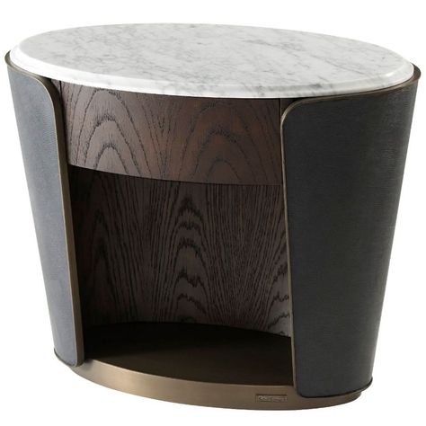 A myriad of textures makes the Armour Oval Bedside Table, Bronze a visual treat in any room.###ABOUT###SMOOTH MARBLEA marble top in an oval shape sits elegantly inside a leather wrapped and metal bound collared case. With a stainless steel base elevating the table with ease, this interesting table will slot well into modern schemes. HERITAGE BRONZEA heritage bronze finish is warm and rich in tone. As a bedside table it will add character whilst offering an inviting storage solution for your nigh Oval Nightstand, Theodore Alexander, Cool Tables, Luxury Interiors, Bedroom Furniture Design, Small Furniture, Furniture Design Modern, Furniture Projects, Leather Wraps