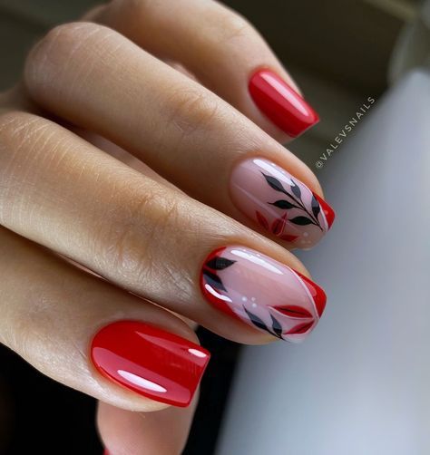 For a striking fall look, this bold red design with leafy accents is perfect. The combination of rich red and black leaves creates a dramatic yet elegant effect.   Photo credit by: @valevsnails Red Concert Nails, Red Gel Nails Short Design, Red French Nail Designs, Red Nails With Black Design, Blue Nail Ideas, Short Fall Nails, Lavender Nail Polish, Fall Nails Ideas, Ombre Gel Nails