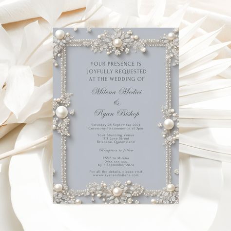 Elevate your wedding celebration with this exquisite invitation template from our exclusive DIAMONDS AND PEARLS collection.  This elegant and editable design allows you to seamlessly personalize every detail. Simply upload your information into Canva, a user-friendly online editor accessible through any web browser or mobile device, and create a truly unique invitation.  This 5 x 7 inch template complements A7 envelopes (5.25 x 7.25 inches) for a perfect fit, ensuring a sophisticated and memorable experience for your guests. 


.#WeddingInvitations #DIYWedding #WeddingStationery #WeddingInspiration #WeddingPlanning Powder Blue White And Gold Wedding, Wedding Invitations Italian, Blue And Pearl Wedding, Ice Blue Wedding Theme, Diamond Wedding Theme, Unique Wedding Invitations Elegant, Elegant Wedding Invitations Luxury, Starlight Wedding, Pearl Invitations