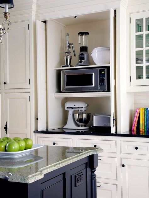 Store your mixer, blender, food processor and other small appliances in a place that off your counter and combat clutter. Get our ideas for custom cabinets, free standing shelves and other storage ideas for these small kitchen appliances. Appliance Closet, Retractable Doors, Hide Appliances, Retractable Door, Farmhouse Kitchen Cabinets, Kitchen Cabinets Makeover, Kitchen Redo, Kitchen Remodel Idea, Kitchen Makeover