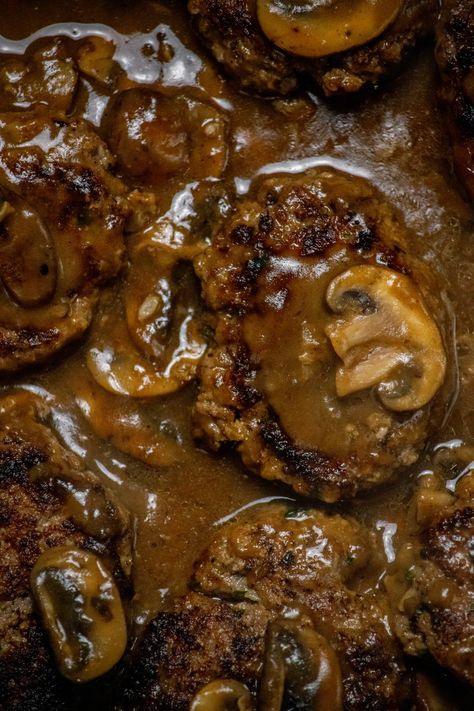 One of the best comfort foods, this Moist Burger Steak Recipe with Mushroom Gravy is a savory and satisfying weeknight meal for any night of the week! With tender beef patties and a flavorful fresh mushroom gravy. Hamburger Patties With Mushroom Gravy, Salsberry Steak With Mushroom Gravy, Burger Steak With Mushroom Gravy, Hamburger Steak With Mushroom Gravy, Burger Steak Recipe, Ground Chuck Recipes, Beef And Mushroom Recipe, Pan Burgers, Burger Patty Recipe