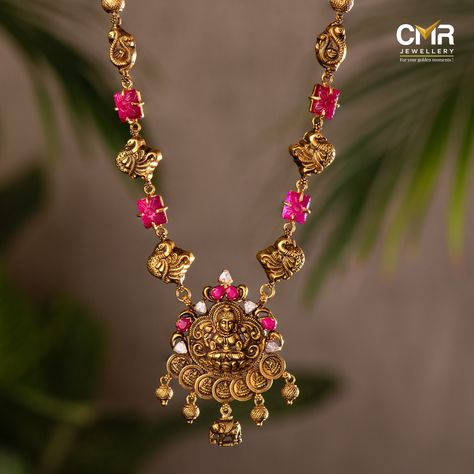 Rock that traditional glam and slay like a diva. Our temple jewellery haarams are adorned with Goddess Lakshmi motifs. Precious gems including rubies, pearls, and Signity Stones, elevate the grace of the jewellery. . . . #haram #neckpiece #haaramoftheday #emerald #haaramlovers #haaramaddict #haaramofinstagarm #ruby #emeralds #goldjewellery #southindianjewellery  #bridesofindia #southindianjewellery #indianjewellery #gold #cmrjewellery #cmrwomen Latest Gold Necklace Designs Indian Temple Jewellery, Temple Jewellery Gold, Mini Haram, Lakshmi Haram, Traditional Glam, Star Jewellery, Temple Jewellery Earrings, Simple Jewellery, Gold Jewels Design